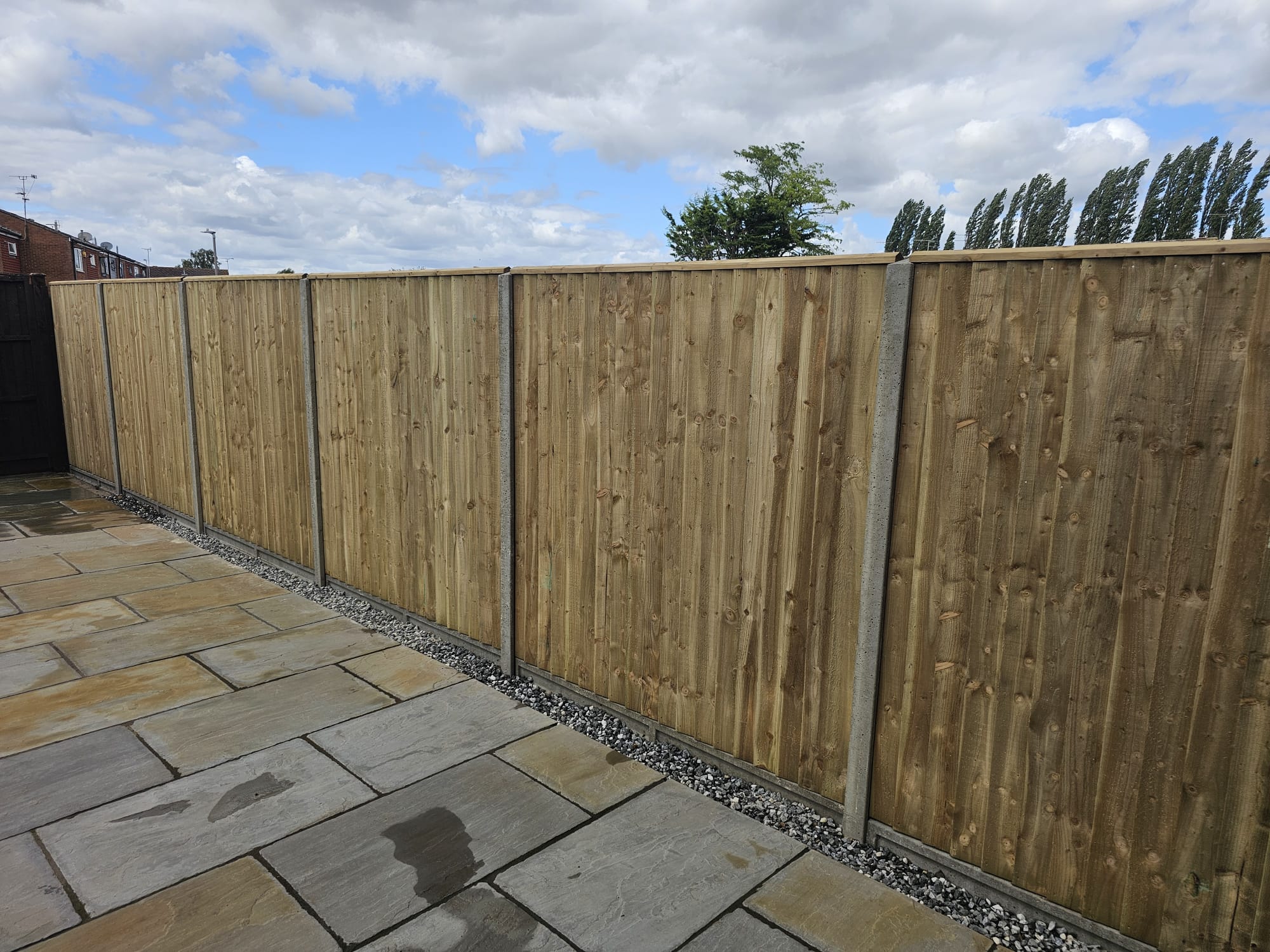 Closeboard fence with concrete posts installed along garden patio boundary in Aylesbury, HP22