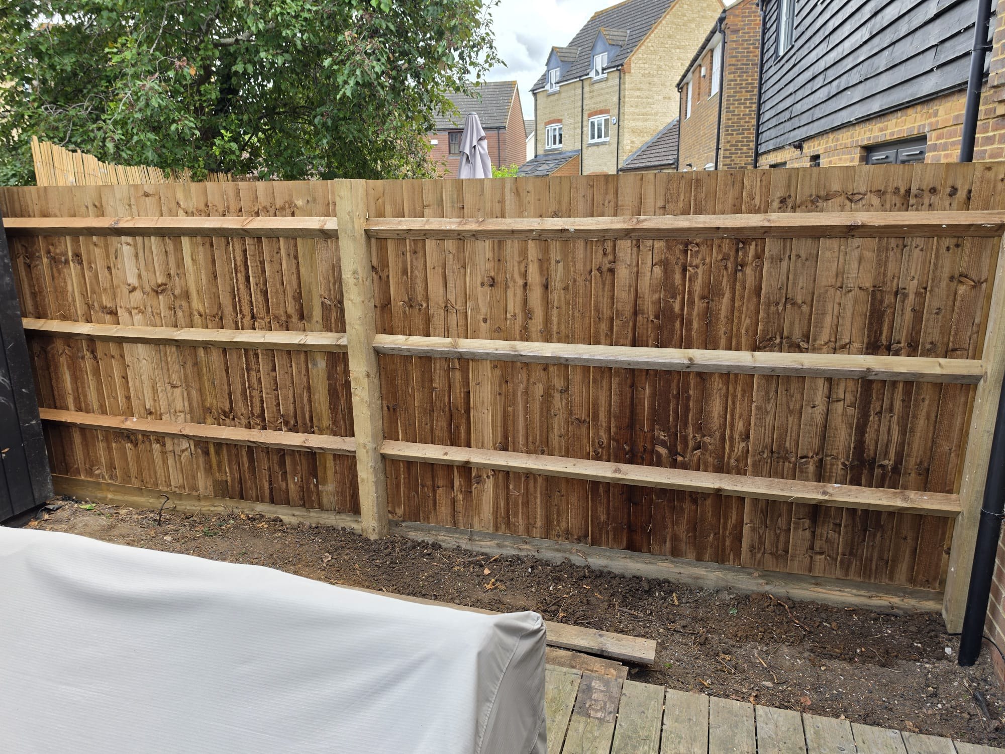 Closeboard featheredge fence with treated timber posts and rails installed by Olive Fencing